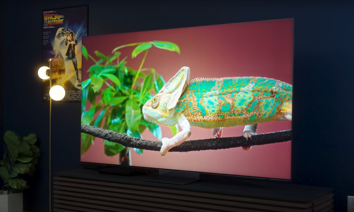 A chameleon on a leafy branch shown on a Samsung QN900D.