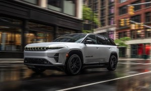 Front view of a 2024 Jeep Wagoneer S driving on a city street.