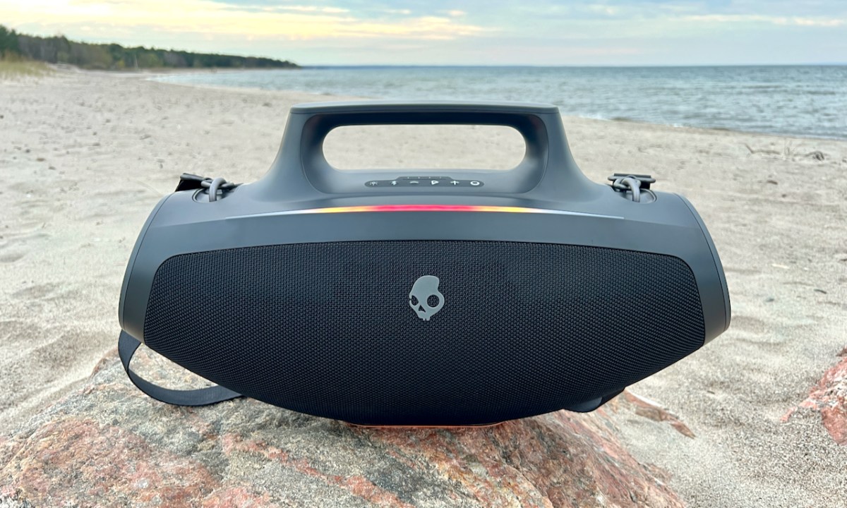 The Skullcandy Barrel Bluetooth speaker on a rock.