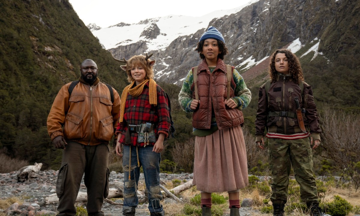 Four people stand on a mountain in Sweet Tooth.