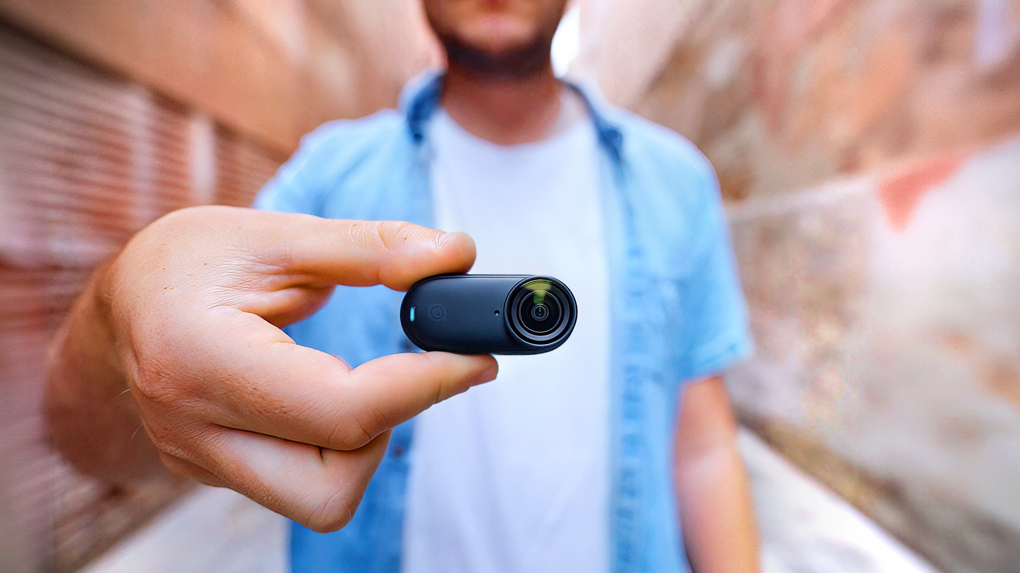 Insta360 Go 3S camera body in hand.