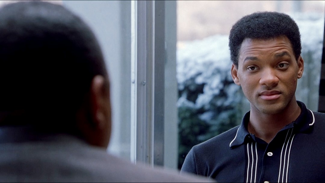 A man talks to another man in Ali.