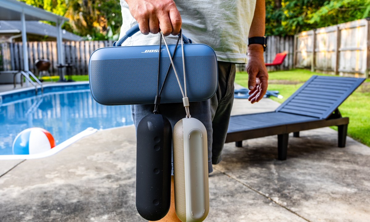 Phil Nickinson carrying the Bose SoundLink Max and two Beats Pill speakers.