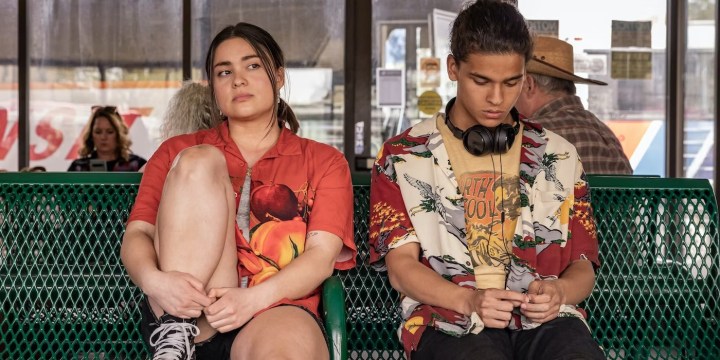 Two teens sit on a bench in Reservation Dogs.