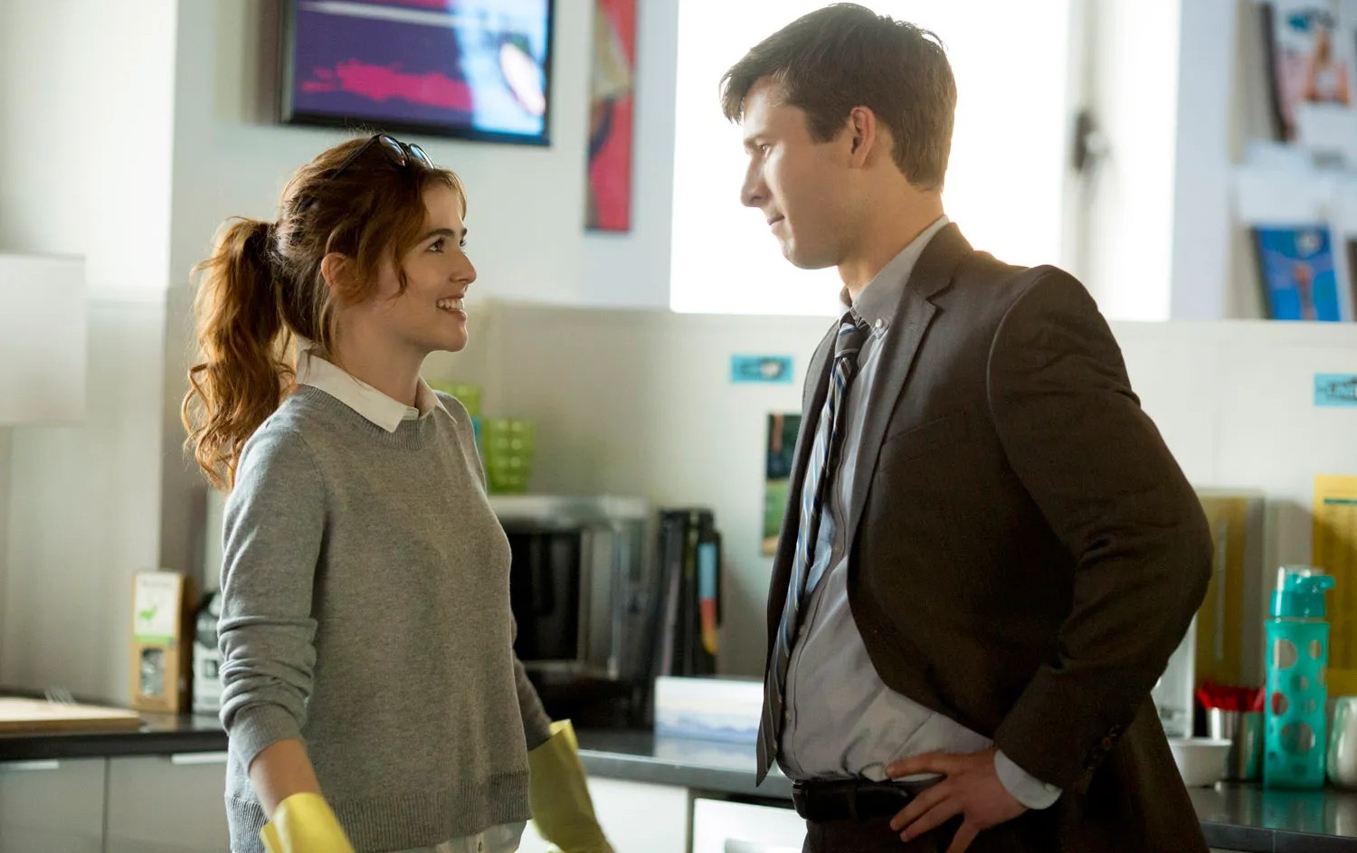 A man and a woman look at each other in Set It Up.
