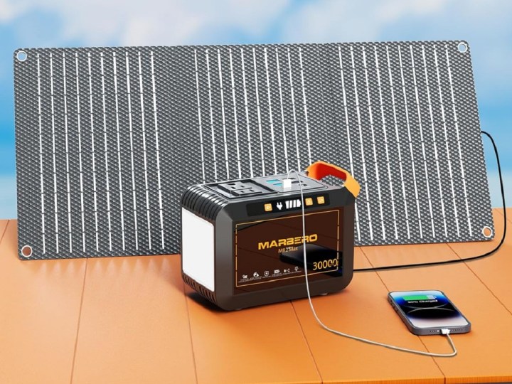 The Marbero M82 Max solar generator with its solar panel, charging a phone.