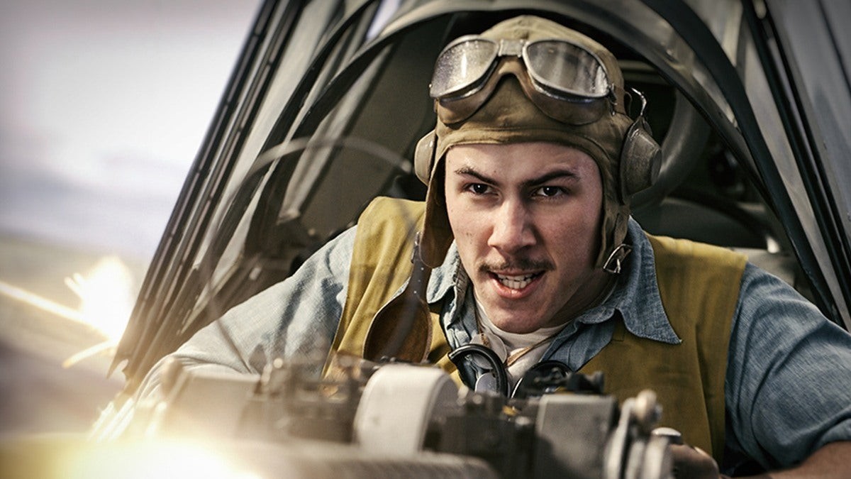 A fighter pilot shoots a gun in Midway.