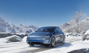 Blue Tesla Model Y Juniper in the snow