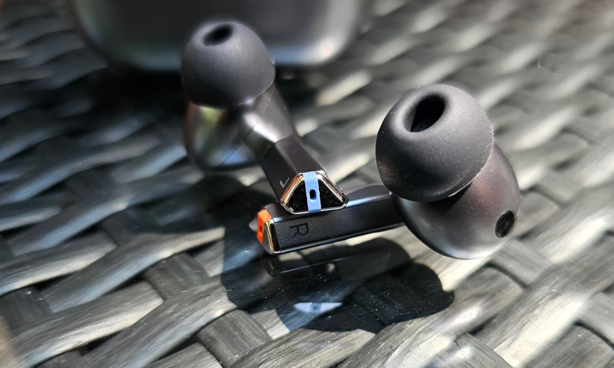 Samsung Galaxy Buds 3 Pro in front of case.