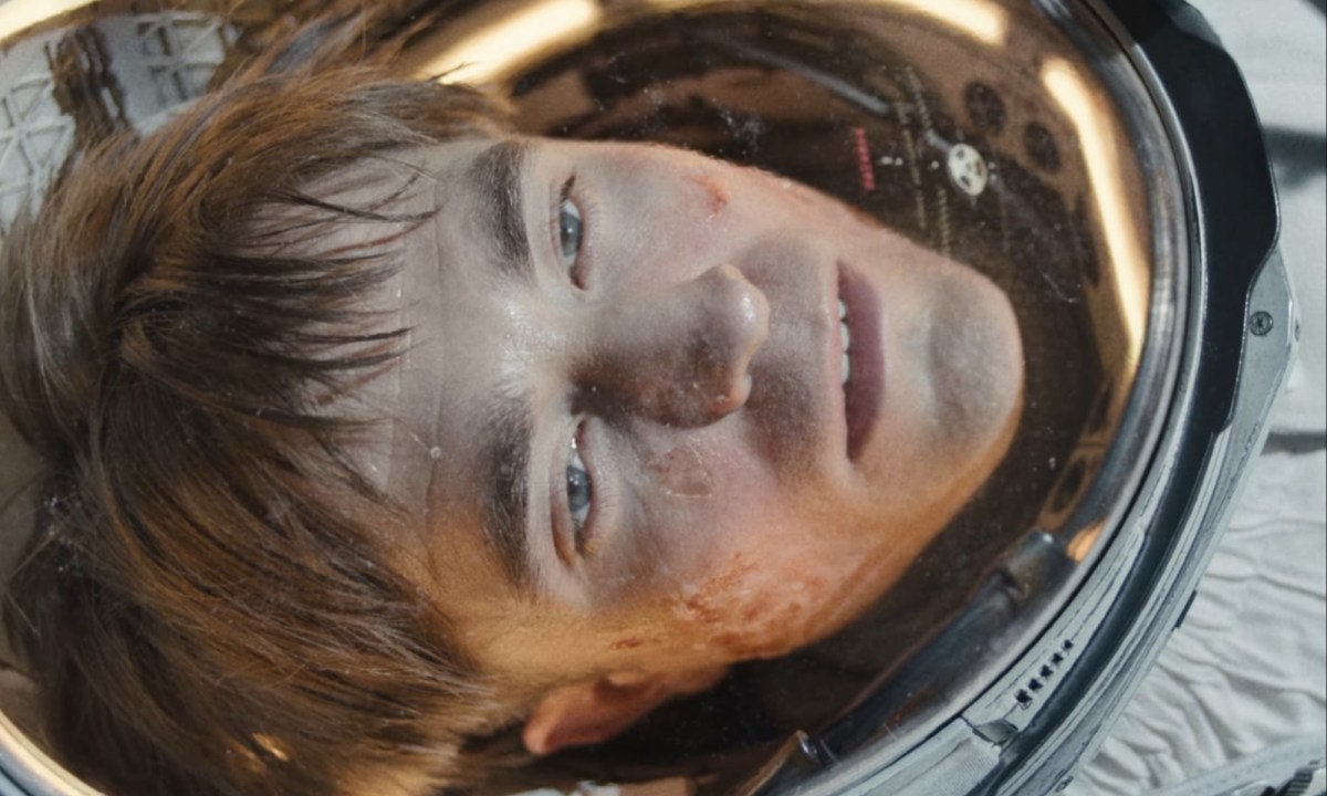 Robert Pattinson as an astronaut stares with a blank expression on his face in "Mickey 17."