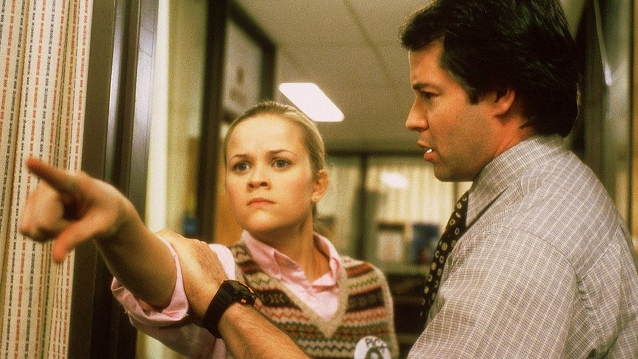 Reese Witherspoon pointing while looking angry as Matthew Broderick looks on in Election.