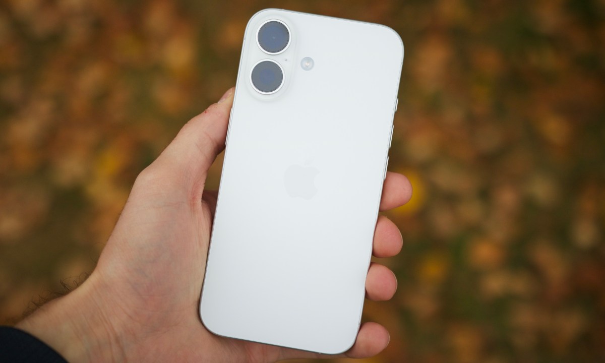 Someone holding the white iPhone 16.
