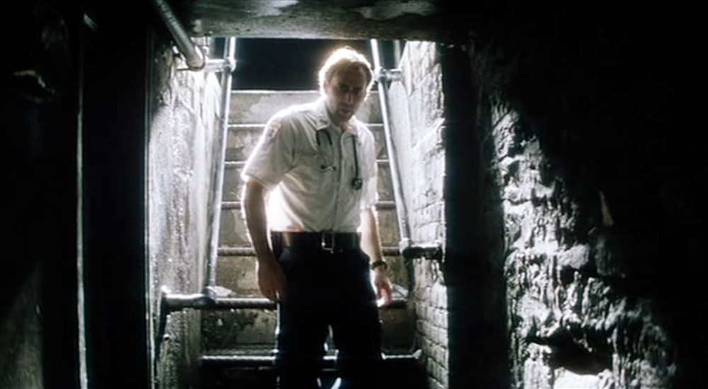 A man walks down steps in Bringing Out the Dead.