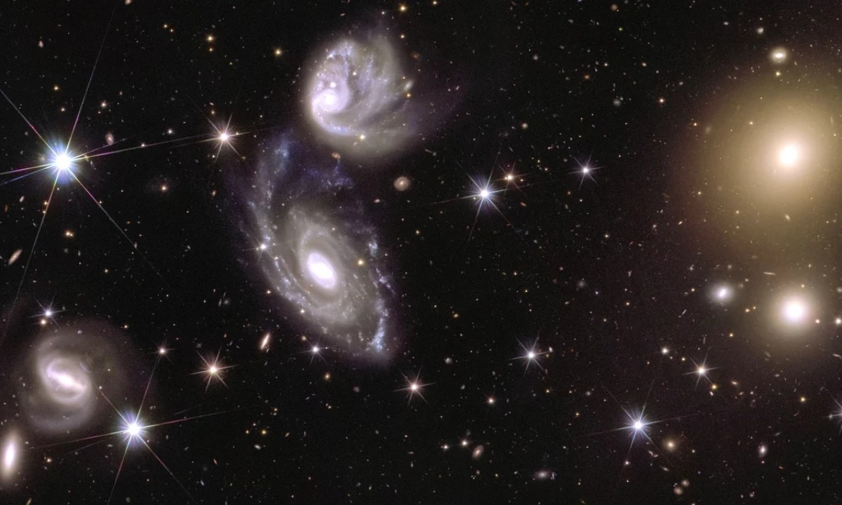 This image shows an area of the mosaic released by ESA’s Euclid space telescope on 15 October 2024. The area is zoomed in 150 times compared to the large mosaic. On the left of the image, Euclid captured two galaxies (called ESO 364-G035 and G036) interacting with each other, 420 million light-years from us. On the right of the image, galaxy cluster Abell 3381 is visible, 678 million light-years away from us.