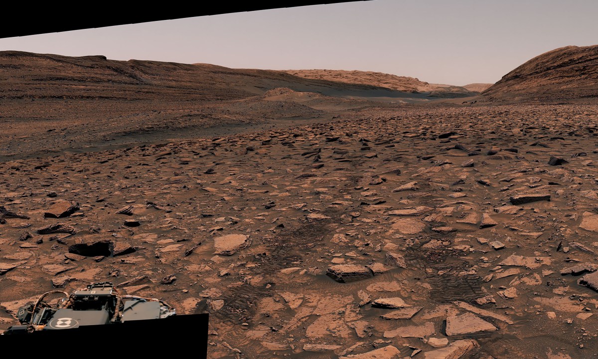 NASA’s Curiosity captured this panorama using its Mastcam while heading west away from Gediz Vallis channel on Nov. 2, 2024, the 4,352nd Martian day, or sol, of the mission. The Mars rover’s tracks across the rocky terrain are visible at right.