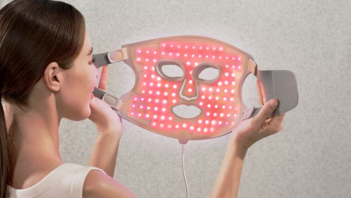 A person holding the Nanoleaf Light Therapy Face Mask