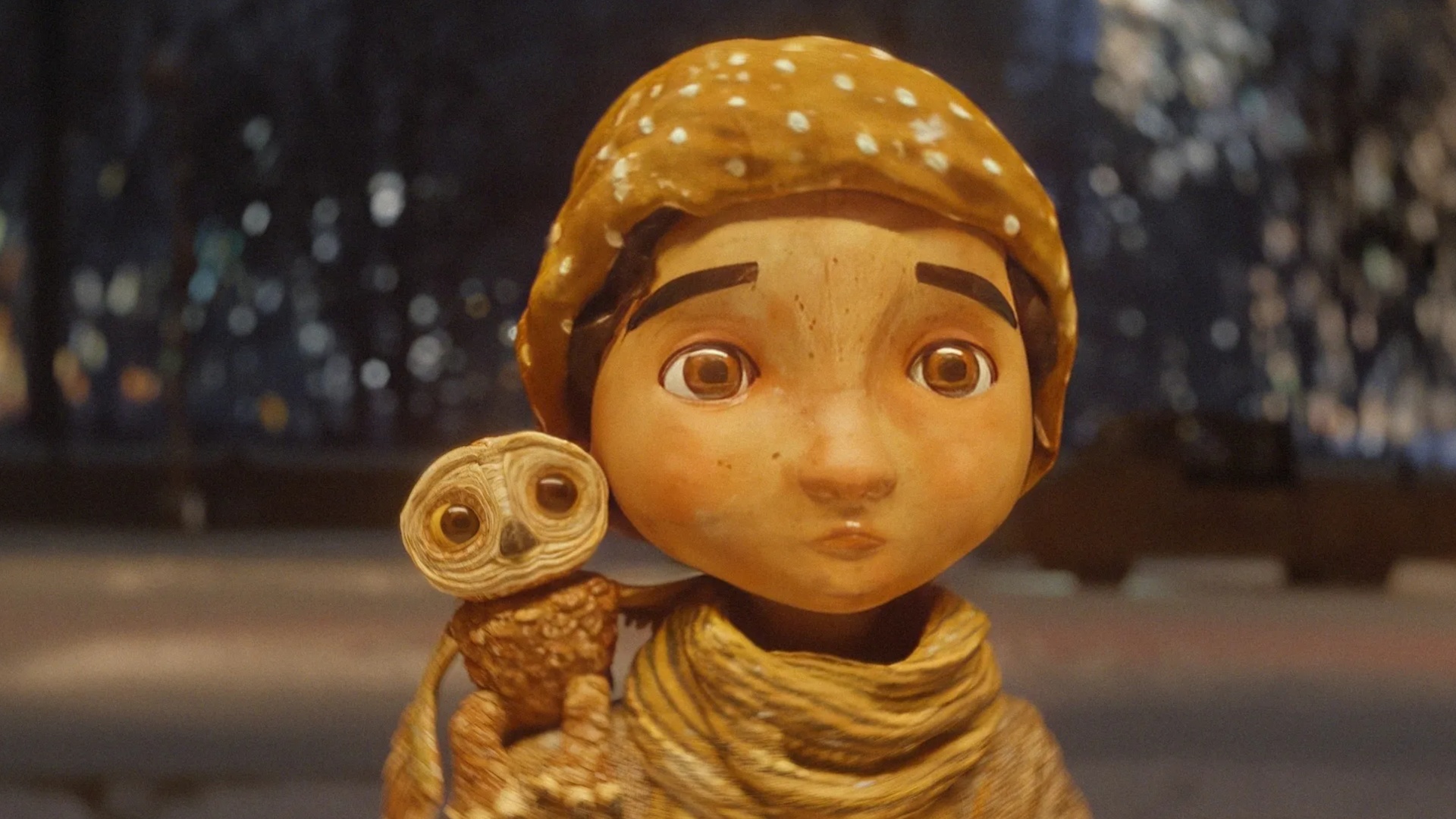 The owl Moon perched on Luna's shoulder in An Almost Christmas Story.