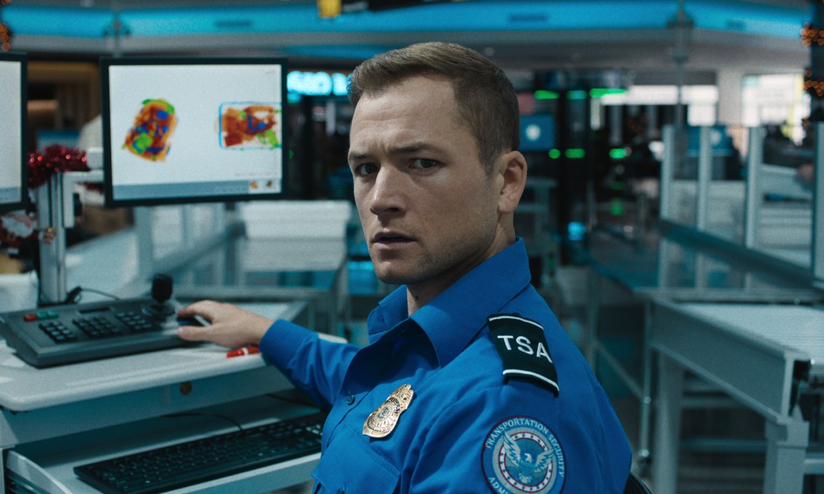 Taron Egerton wears a TSA uniform in Carry-On.