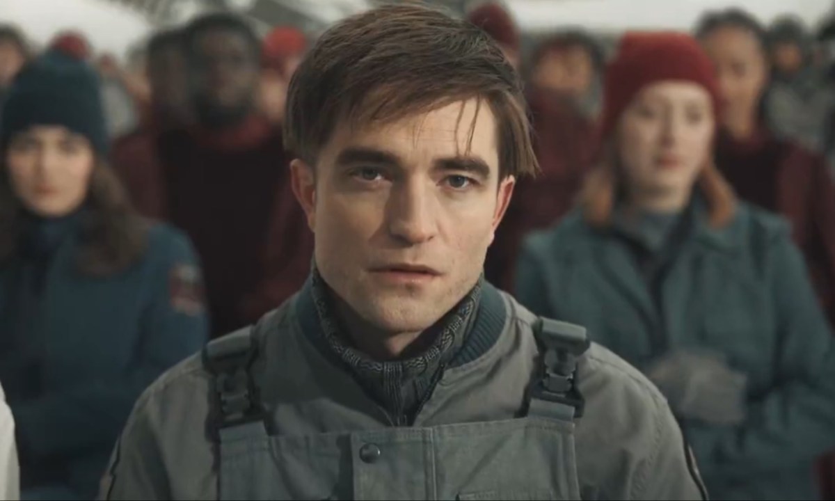 Robert Pattinson stares with a confused look in Mickey 17.