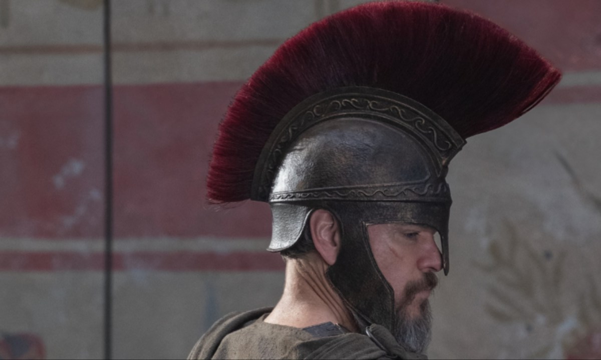 Matt Damon stares with a helmet on.