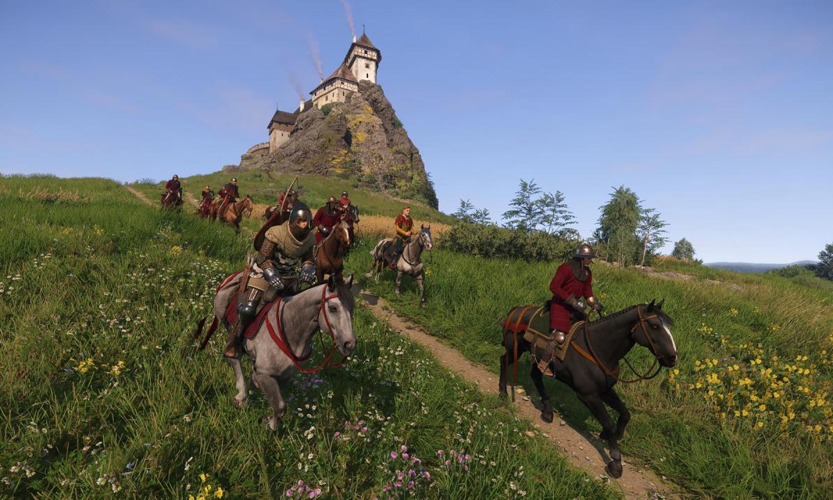 Horsemen ride down a hill in Kingdom Come: Deliverance 2.