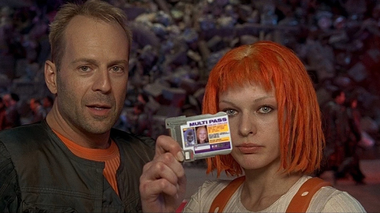 A man and woman stand together, she holding up an ID in The Fifth Element.