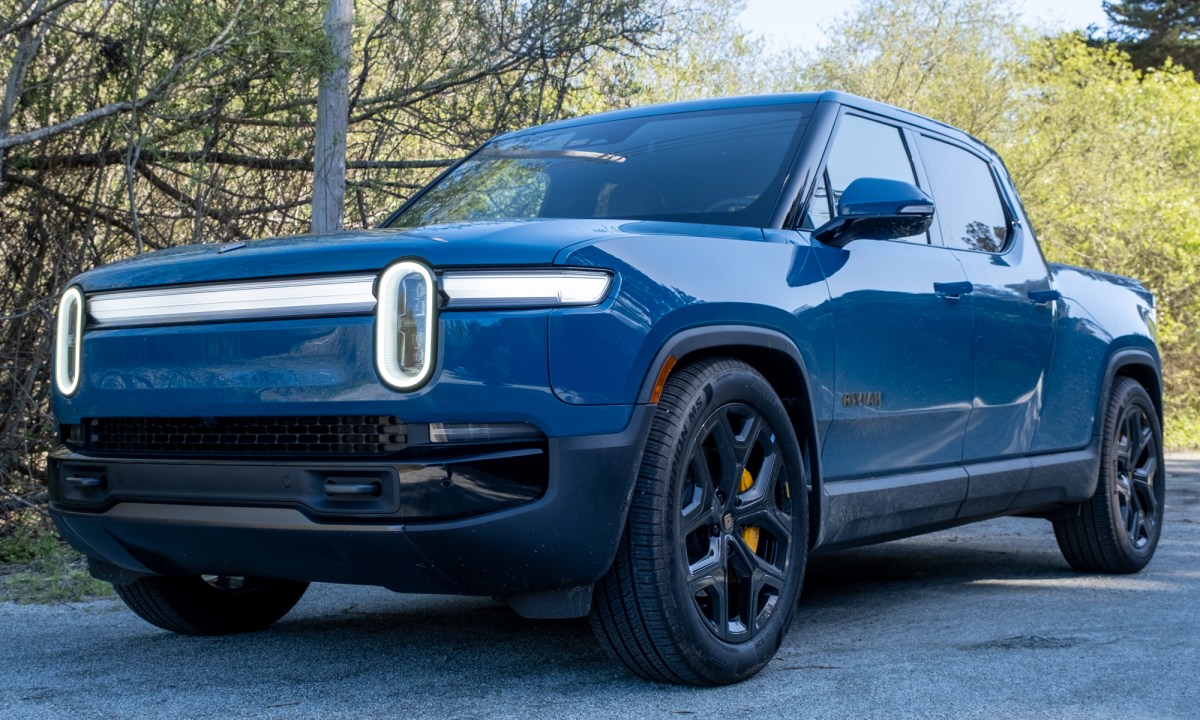 The front and side of a blue 2025 Rivian R1T truck