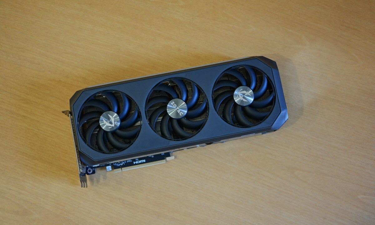 The Zotac RTX 5070 Ti Amp Extreme Infinity graphics card placed on a wooden surface