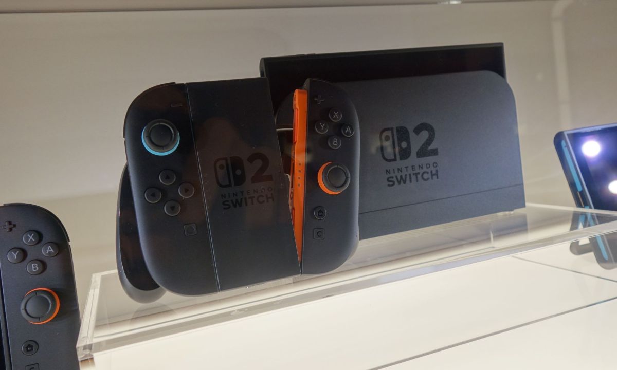 A Switch 2 sits on a display next to its controller.